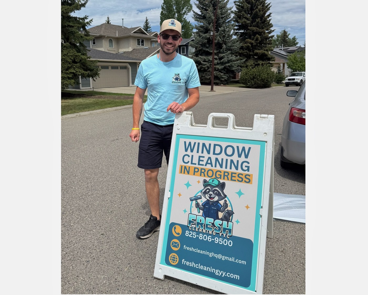 Darren, owner-operator of Fresh Cleaning YYC, with the window cleaning sign in Calgary